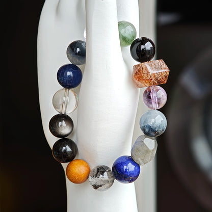 Quietly powerful, this strand unites Black Gold Super Seven, Herkimer diamonds, clear quartz, sandalwood, amethyst, silver obsidian, white phantom, and kyanite in slate and steel hues.