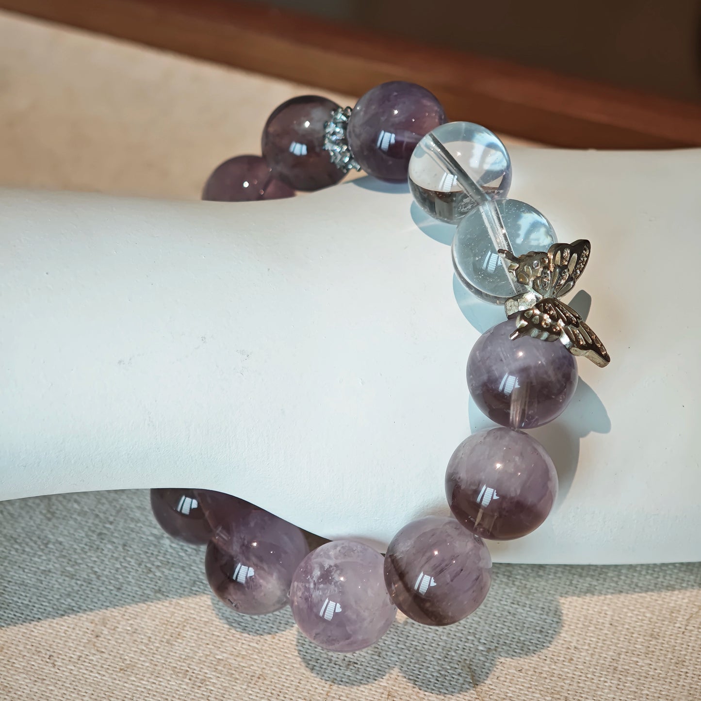 This is an artisan Purple Rabbit Hair Crystal Healing Bracelet, which is handmade with Lavender Amethyst, Clear Quartz & Butterfly Charm.