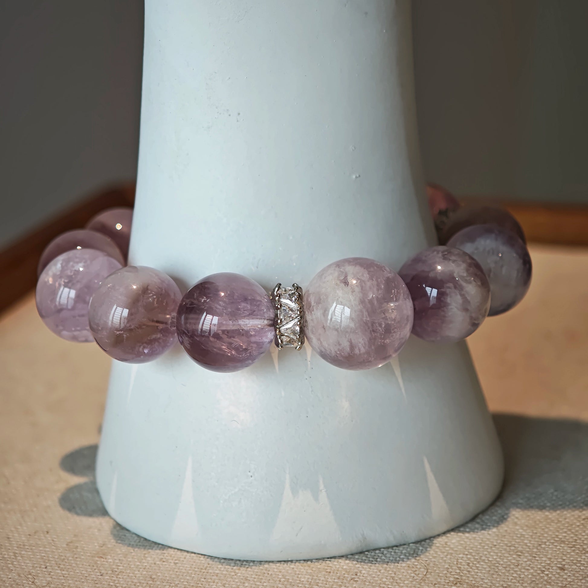This is an artisan Purple Rabbit Hair Crystal Healing Bracelet, which is handmade with Lavender Amethyst, Clear Quartz & Butterfly Charm.