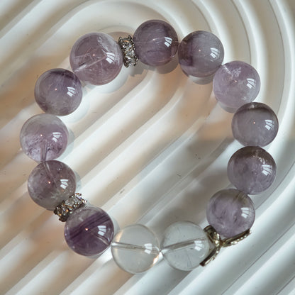 This is an artisan Purple Rabbit Hair Crystal Healing Bracelet, which is handmade with Lavender Amethyst, Clear Quartz & Butterfly Charm.
