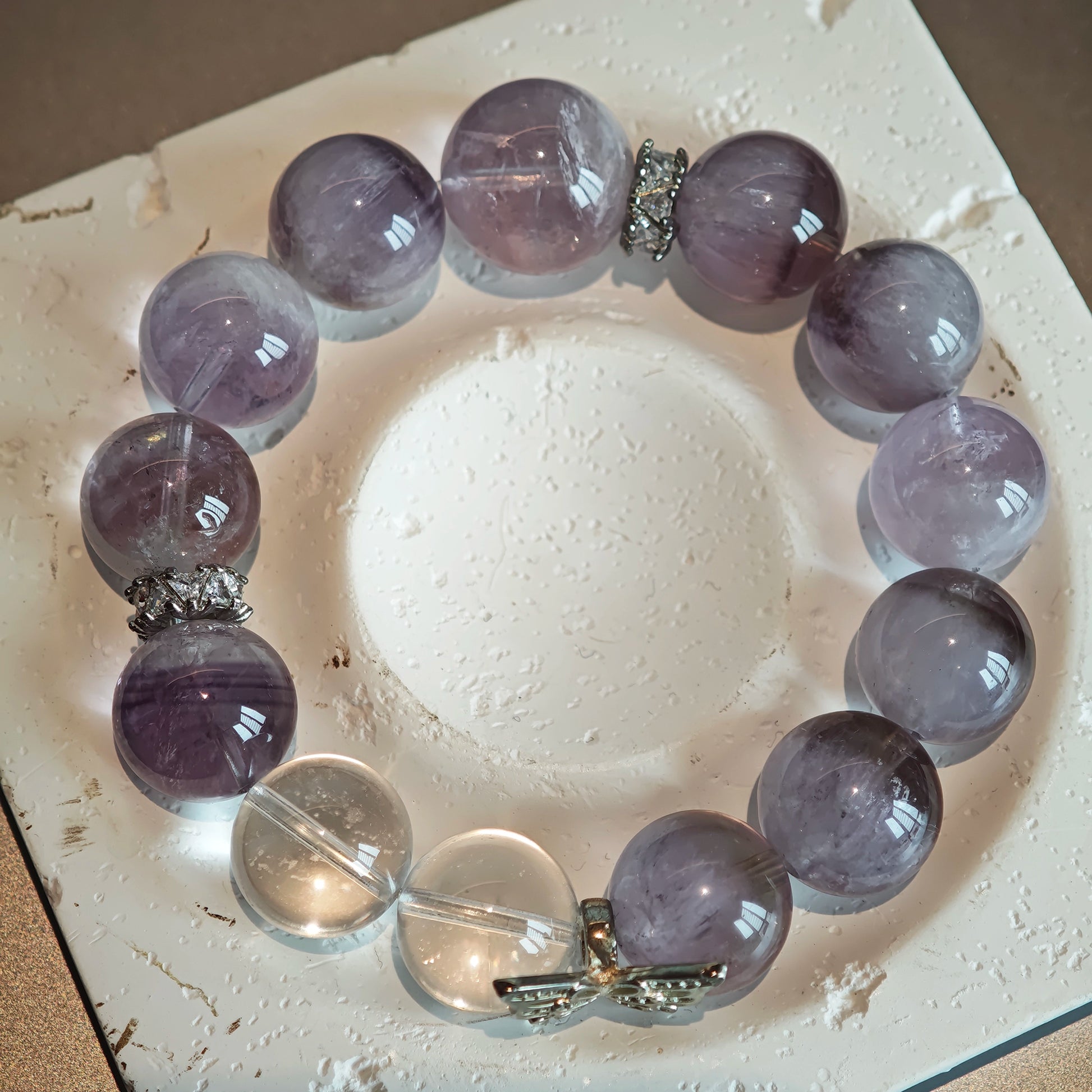 This is an artisan Purple Rabbit Hair Crystal Healing Bracelet, which is handmade with Lavender Amethyst, Clear Quartz & Butterfly Charm.