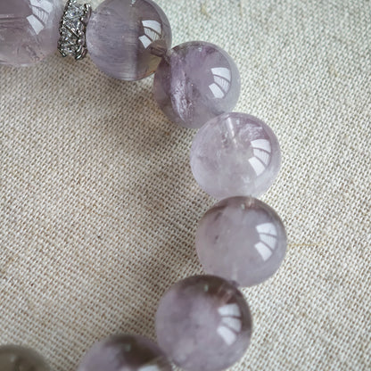 This is an artisan Purple Rabbit Hair Crystal Healing Bracelet, which is handmade with Lavender Amethyst, Clear Quartz & Butterfly Charm.