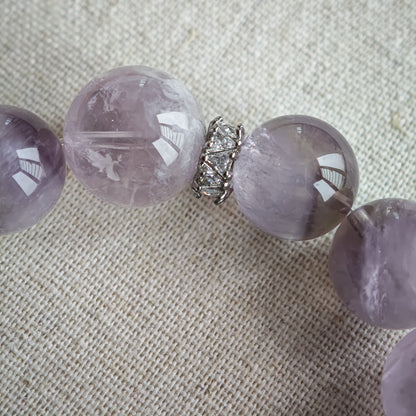 This is an artisan Purple Rabbit Hair Crystal Healing Bracelet, which is handmade with Lavender Amethyst, Clear Quartz & Butterfly Charm.