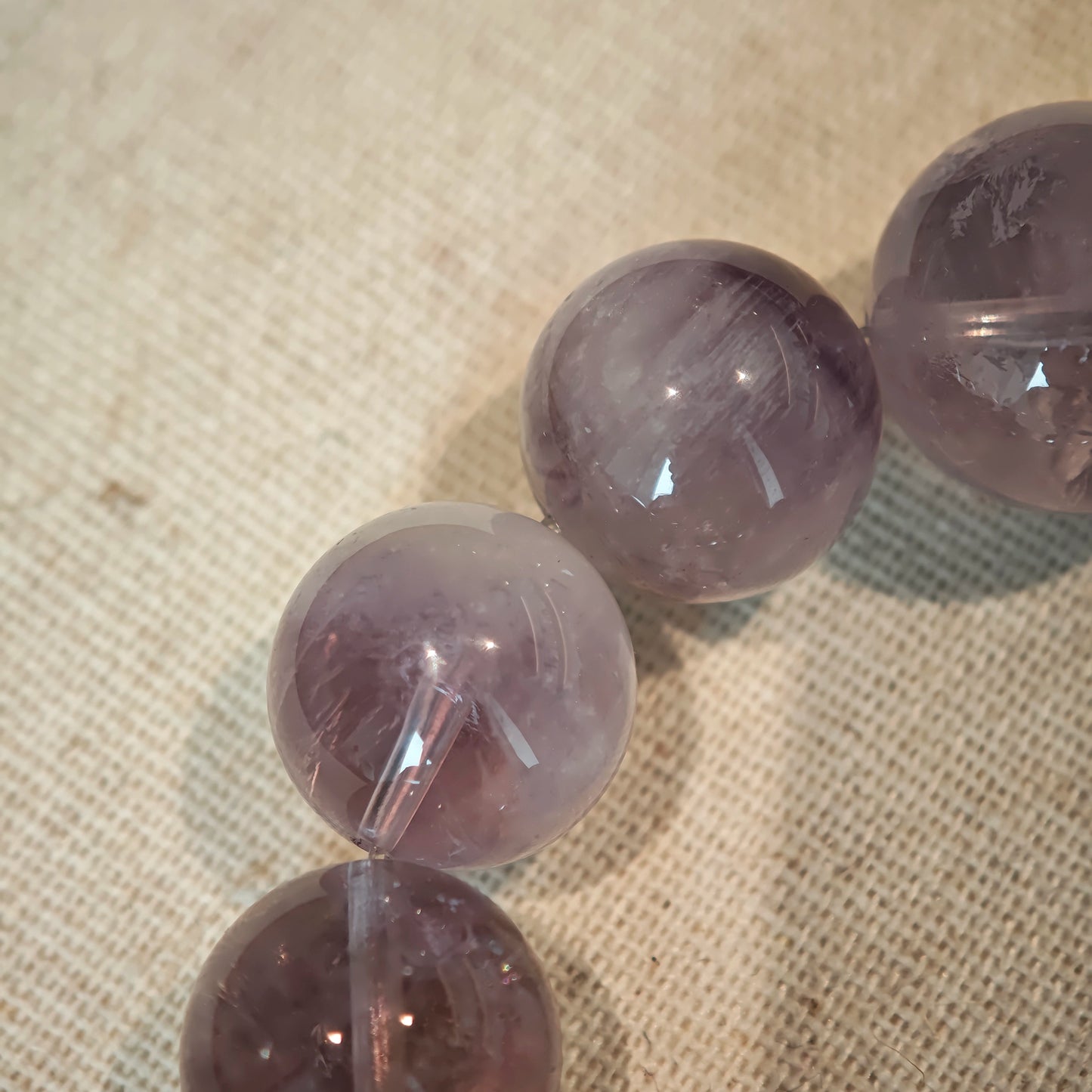 This is an artisan Purple Rabbit Hair Crystal Healing Bracelet, which is handmade with Lavender Amethyst, Clear Quartz & Butterfly Charm.