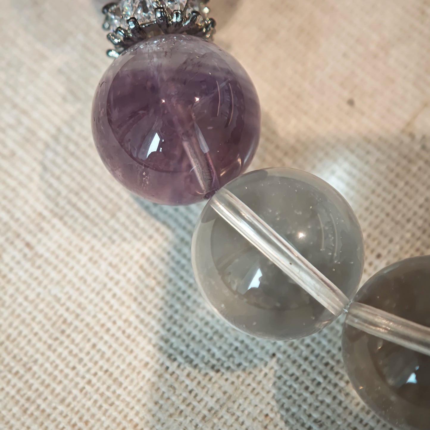 This is an artisan Purple Rabbit Hair Crystal Healing Bracelet, which is handmade with Lavender Amethyst, Clear Quartz & Butterfly Charm.