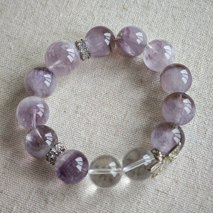 This is an artisan Purple Rabbit Hair Crystal Healing Bracelet, which is handmade with Lavender Amethyst, Clear Quartz & Butterfly Charm.