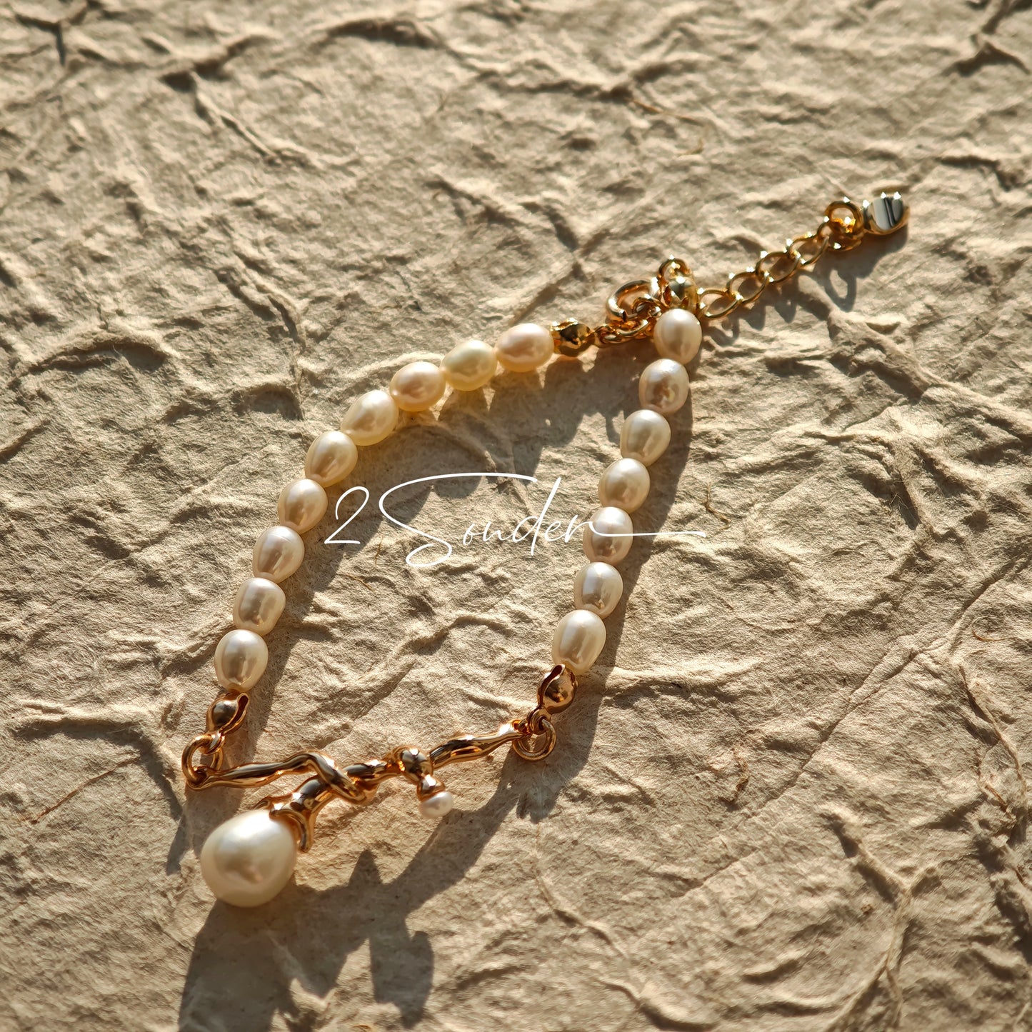 This bracelet is inspired by the romantic concept of "intertwined destiny," the vintage gold color sterling silver gently wraps together like vines. The end of the vines are plated lustrous Freshwater Pearls, symbolizing the beautiful bonds of life.