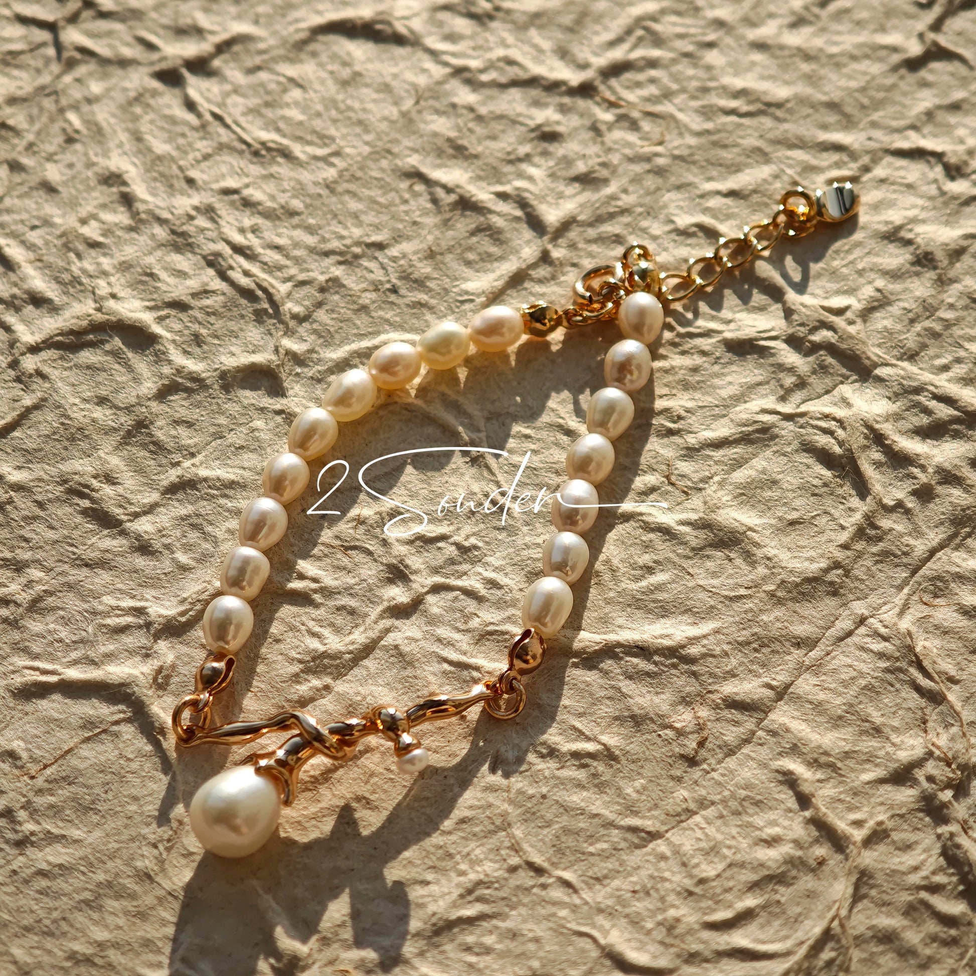 This bracelet is inspired by the romantic concept of "intertwined destiny," the vintage gold color sterling silver gently wraps together like vines. The end of the vines are plated lustrous Freshwater Pearls, symbolizing the beautiful bonds of life.