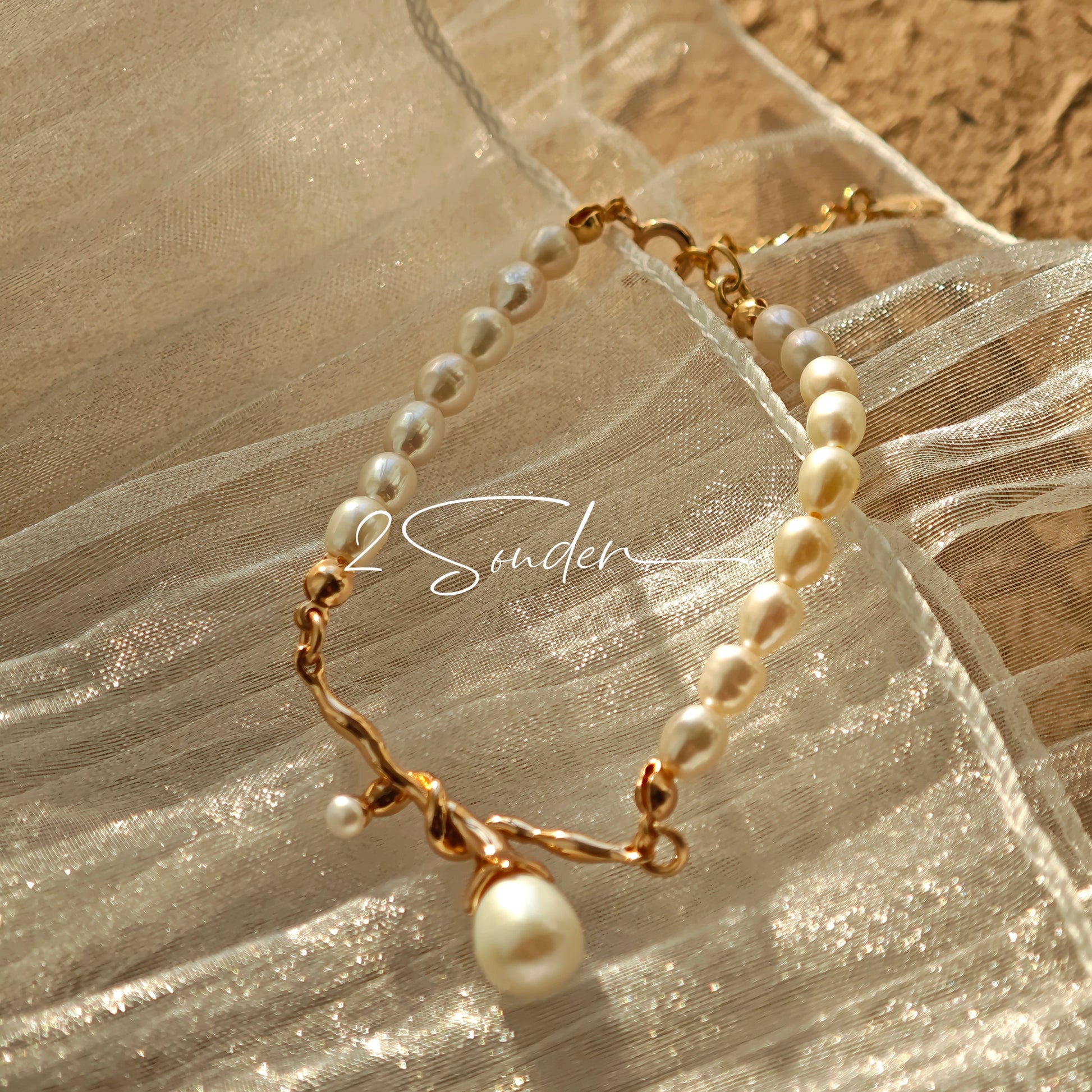 This bracelet is inspired by the romantic concept of "intertwined destiny," the vintage gold color sterling silver gently wraps together like vines. The end of the vines are plated lustrous Freshwater Pearls, symbolizing the beautiful bonds of life.