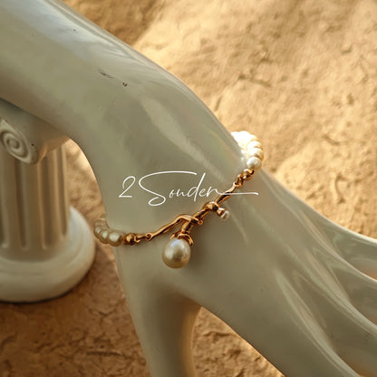 This bracelet is inspired by the romantic concept of "intertwined destiny," the vintage gold color sterling silver gently wraps together like vines. The end of the vines are plated lustrous Freshwater Pearls, symbolizing the beautiful bonds of life.