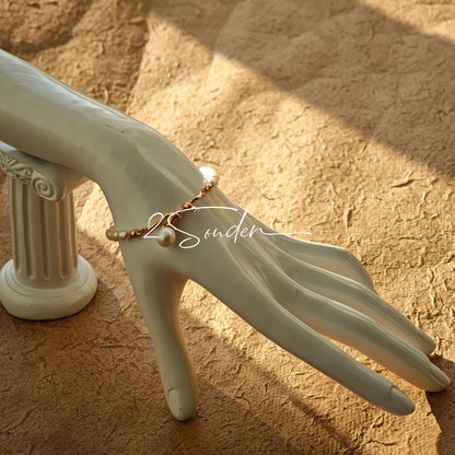 This bracelet is inspired by the romantic concept of "intertwined destiny," the vintage gold color sterling silver gently wraps together like vines. The end of the vines are plated lustrous Freshwater Pearls, symbolizing the beautiful bonds of life.