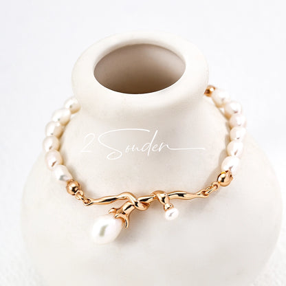 This bracelet is inspired by the romantic concept of "intertwined destiny," the vintage gold color sterling silver gently wraps together like vines. The end of the vines are plated lustrous Freshwater Pearls, symbolizing the beautiful bonds of life.