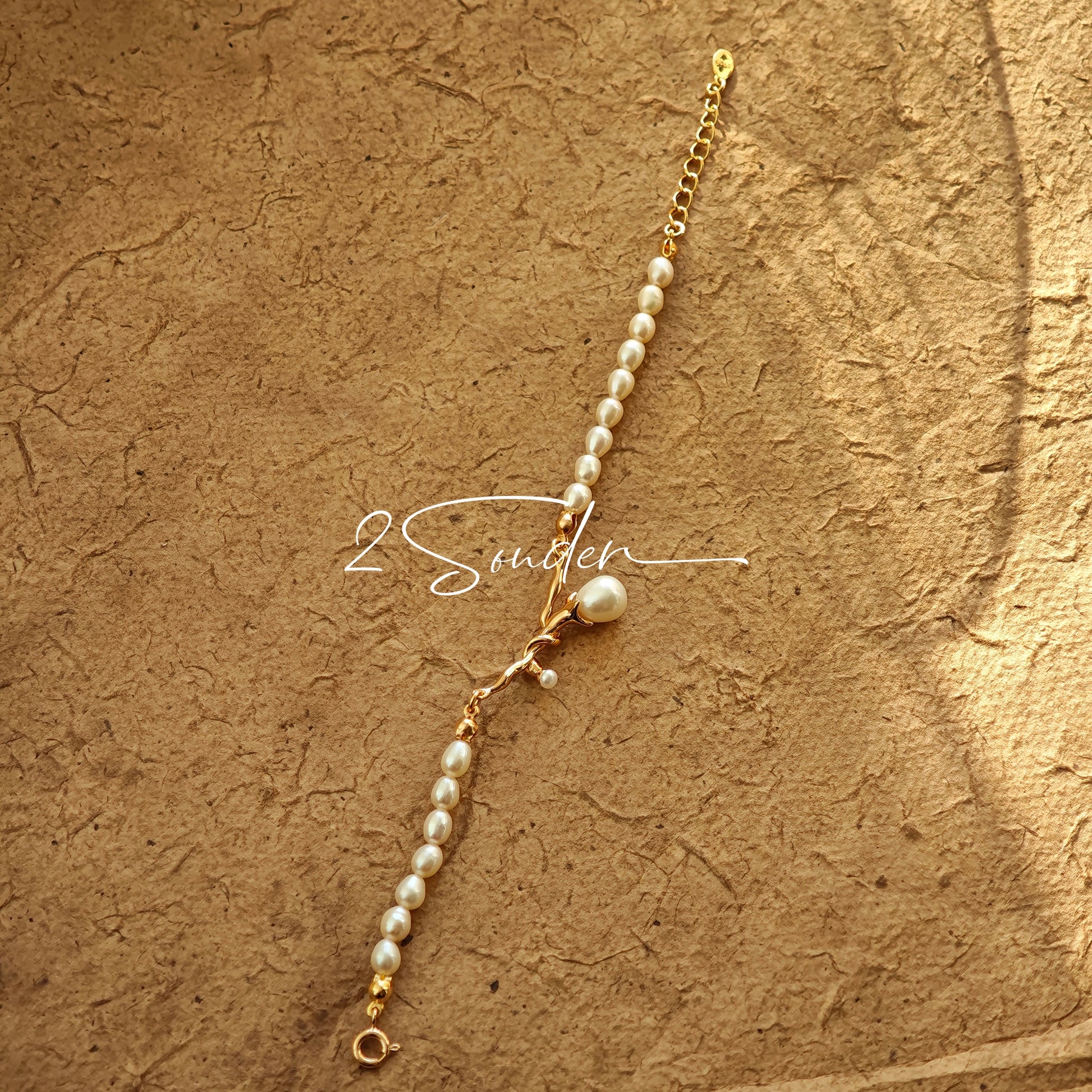 This bracelet is inspired by the romantic concept of "intertwined destiny," the vintage gold color sterling silver gently wraps together like vines. The end of the vines are plated lustrous Freshwater Pearls, symbolizing the beautiful bonds of life.