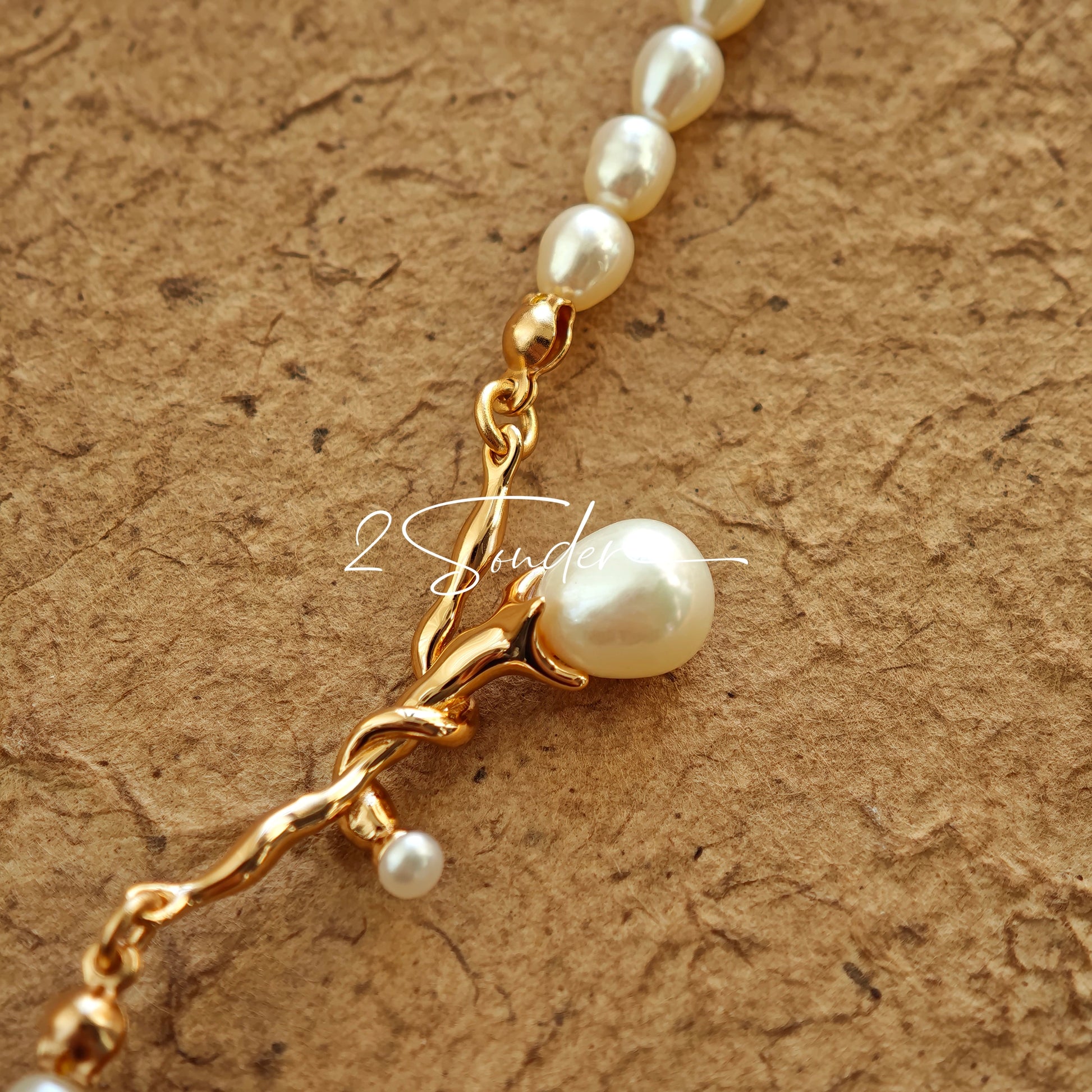 This bracelet is inspired by the romantic concept of "intertwined destiny," the vintage gold color sterling silver gently wraps together like vines. The end of the vines are plated lustrous Freshwater Pearls, symbolizing the beautiful bonds of life.