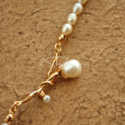 This bracelet is inspired by the romantic concept of "intertwined destiny," the vintage gold color sterling silver gently wraps together like vines. The end of the vines are plated lustrous Freshwater Pearls, symbolizing the beautiful bonds of life.