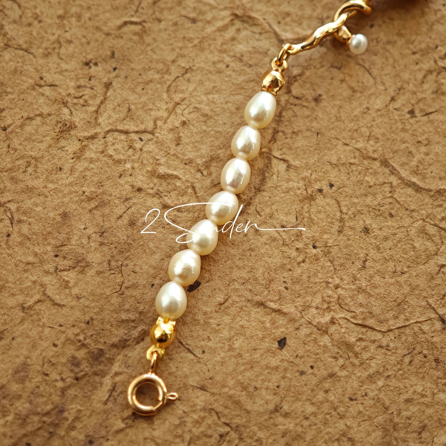 This bracelet is inspired by the romantic concept of "intertwined destiny," the vintage gold color sterling silver gently wraps together like vines. The end of the vines are plated lustrous Freshwater Pearls, symbolizing the beautiful bonds of life.