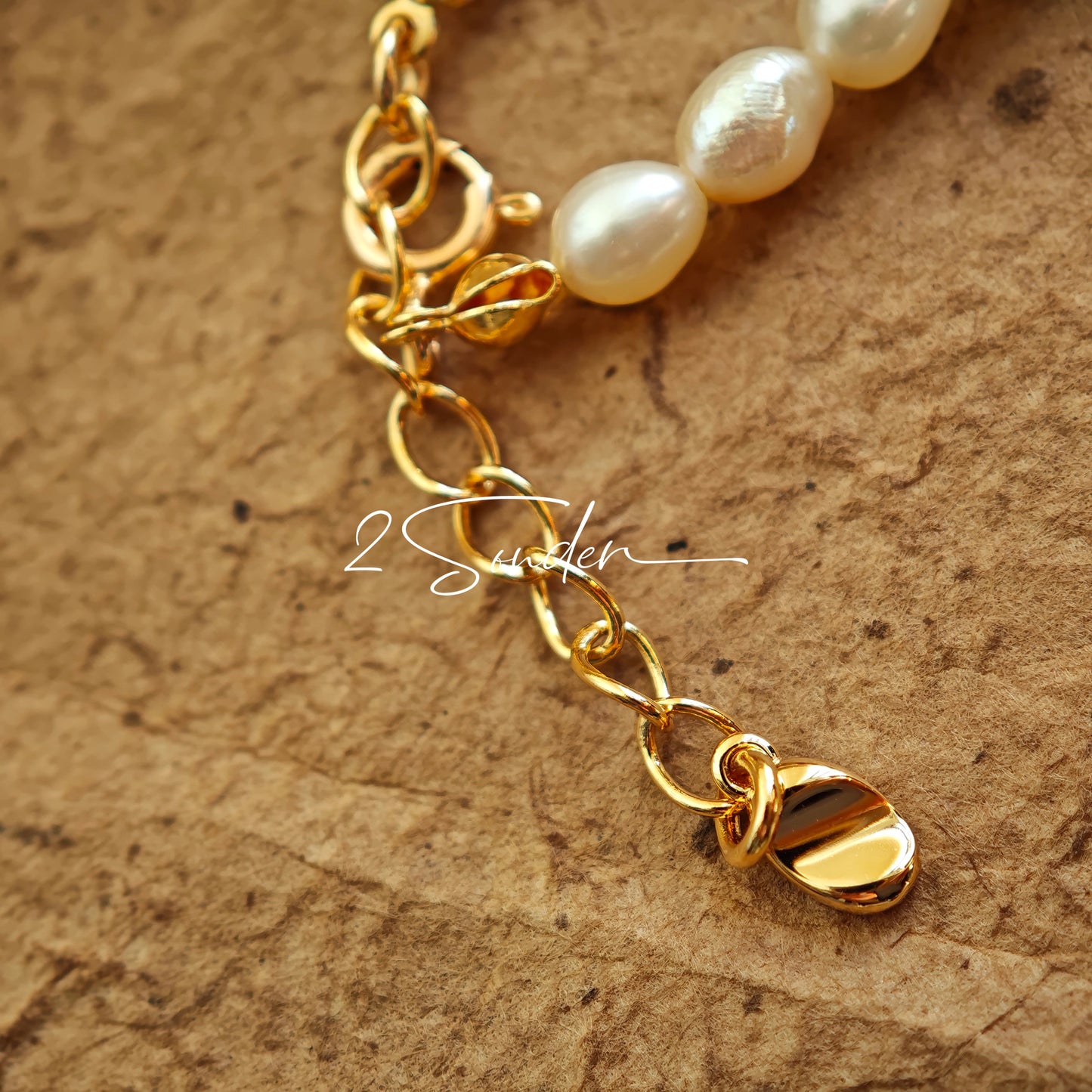 This bracelet is inspired by the romantic concept of "intertwined destiny," the vintage gold color sterling silver gently wraps together like vines. The end of the vines are plated lustrous Freshwater Pearls, symbolizing the beautiful bonds of life.
