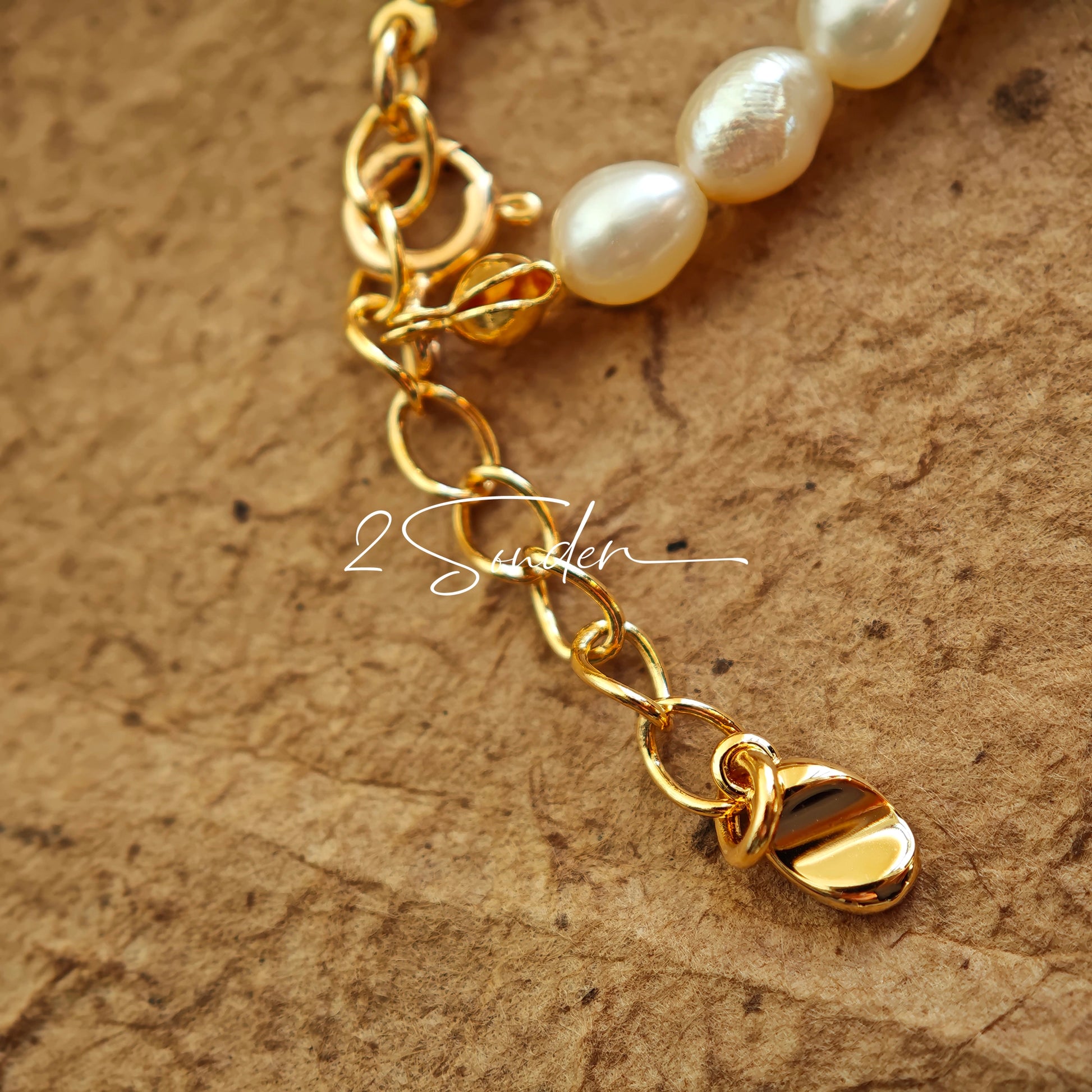This bracelet is inspired by the romantic concept of "intertwined destiny," the vintage gold color sterling silver gently wraps together like vines. The end of the vines are plated lustrous Freshwater Pearls, symbolizing the beautiful bonds of life.
