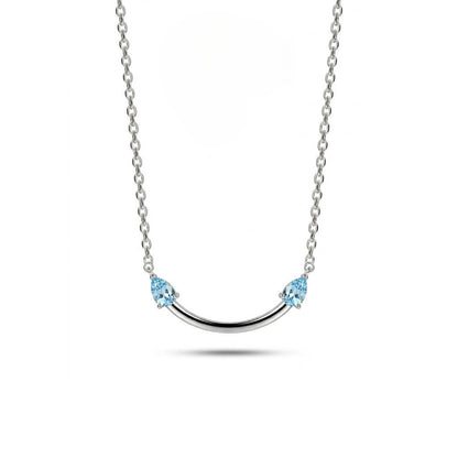 Crafted from polished S925 Sterling Silver, this necklace features a delicate 2.4cm curved bar pendant adorned with shimmering Blue Zircons to mimic a gentle, confident smile. The minimalist design is suspended on an adjustable 40cm clavicle chain, offering a mirror-like finish and a sophisticated touch of quiet luxury.