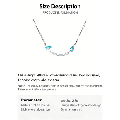 Crafted from polished S925 Sterling Silver, this necklace features a delicate 2.4cm curved bar pendant adorned with shimmering Blue Zircons to mimic a gentle, confident smile. The minimalist design is suspended on an adjustable 40cm clavicle chain, offering a mirror-like finish and a sophisticated touch of quiet luxury.