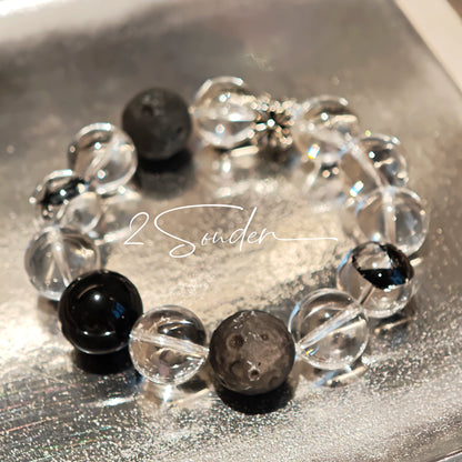 This is a bracelet consists of silver sheen obsidian, clear quartz, herkimer diamonds, meteorite and edgy accents.