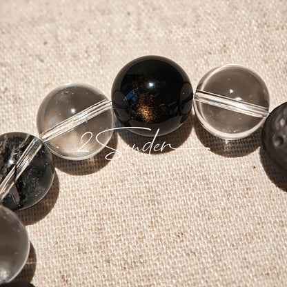 This is a bracelet consists of silver sheen obsidian, clear quartz, herkimer diamonds, meteorite and edgy accents.