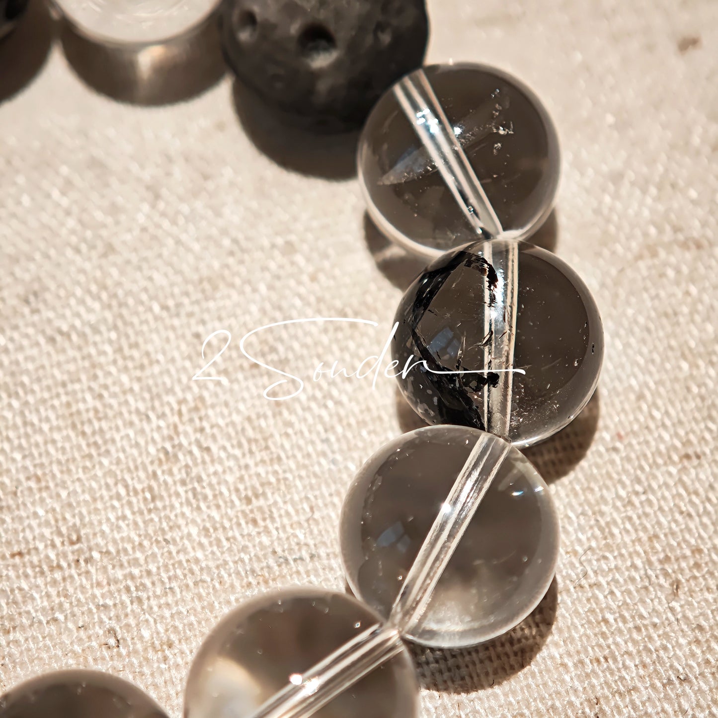 This is a bracelet consists of silver sheen obsidian, clear quartz, herkimer diamonds, meteorite and edgy accents.