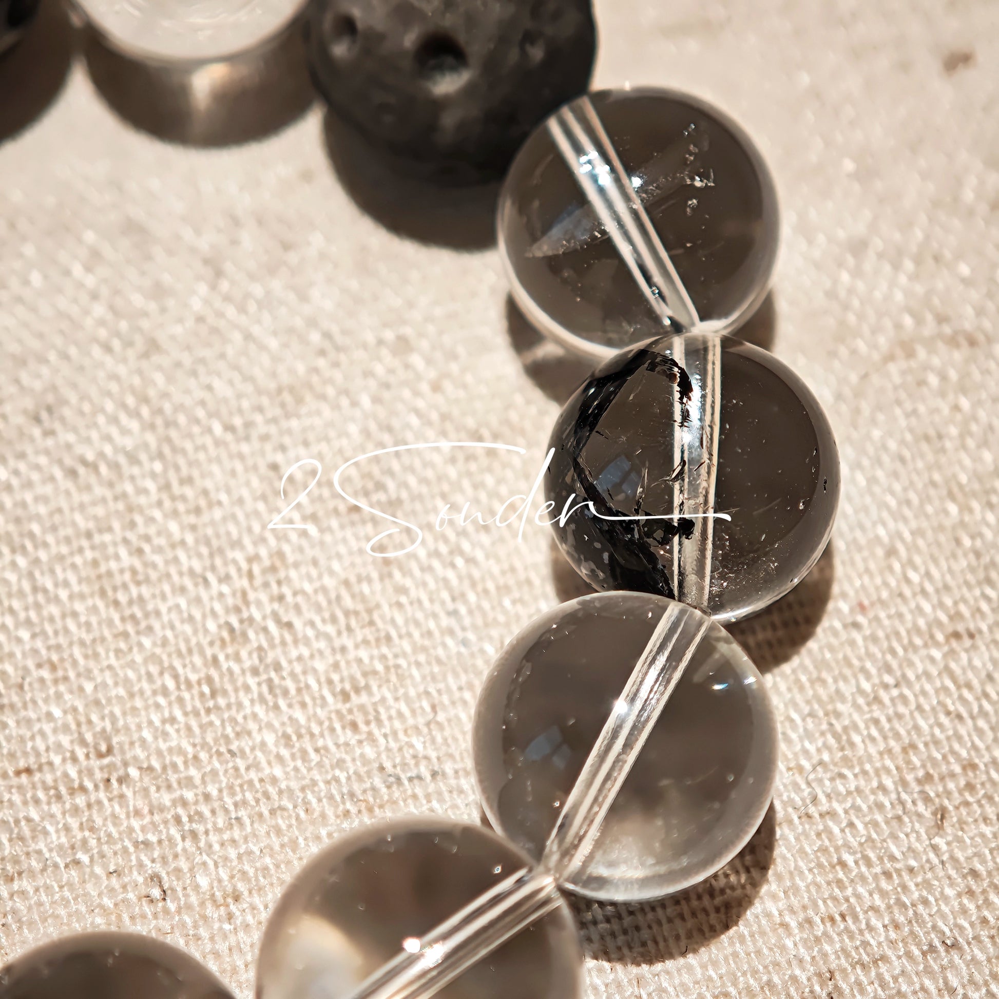 This is a bracelet consists of silver sheen obsidian, clear quartz, herkimer diamonds, meteorite and edgy accents.