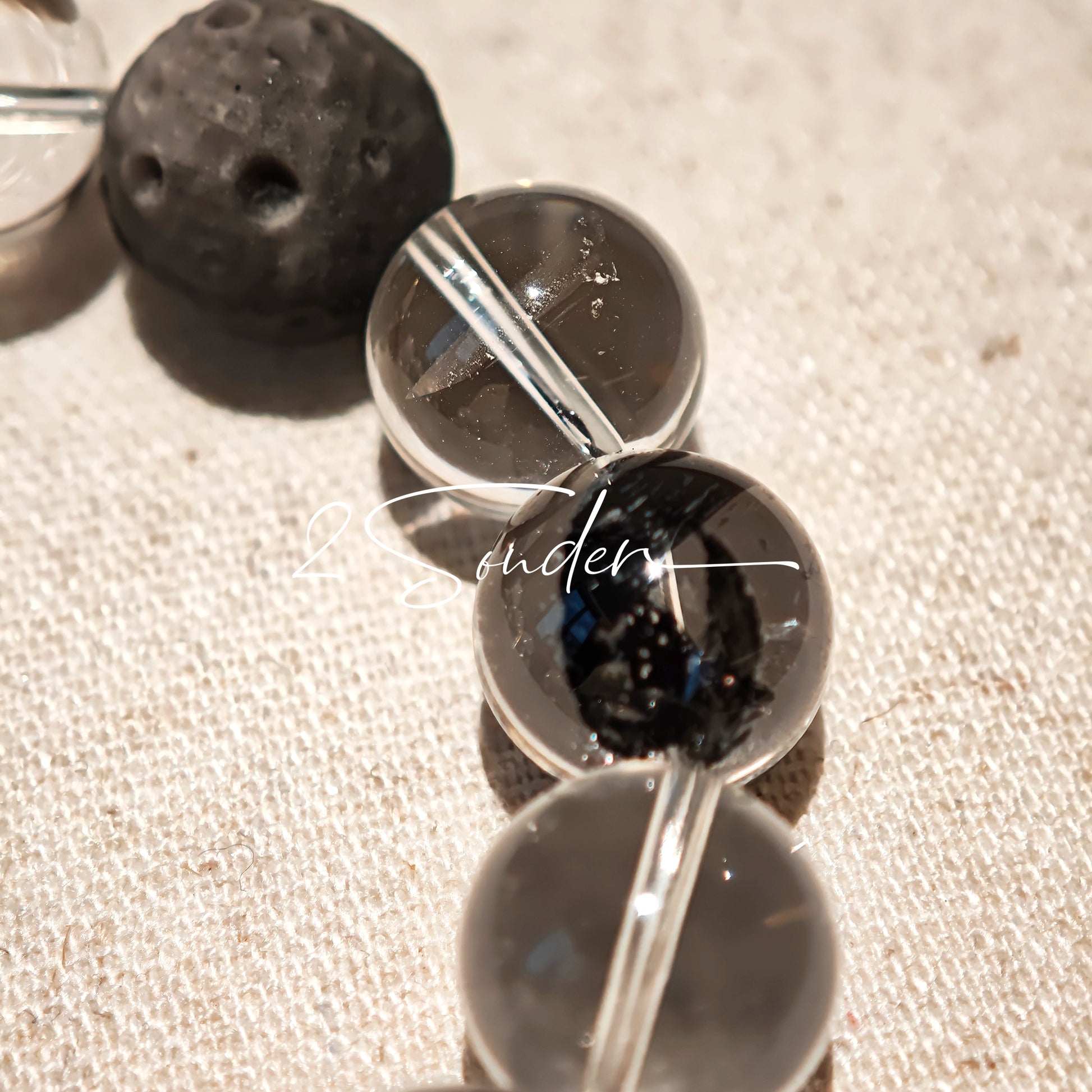 This is a bracelet consists of silver sheen obsidian, clear quartz, herkimer diamonds, meteorite and edgy accents.