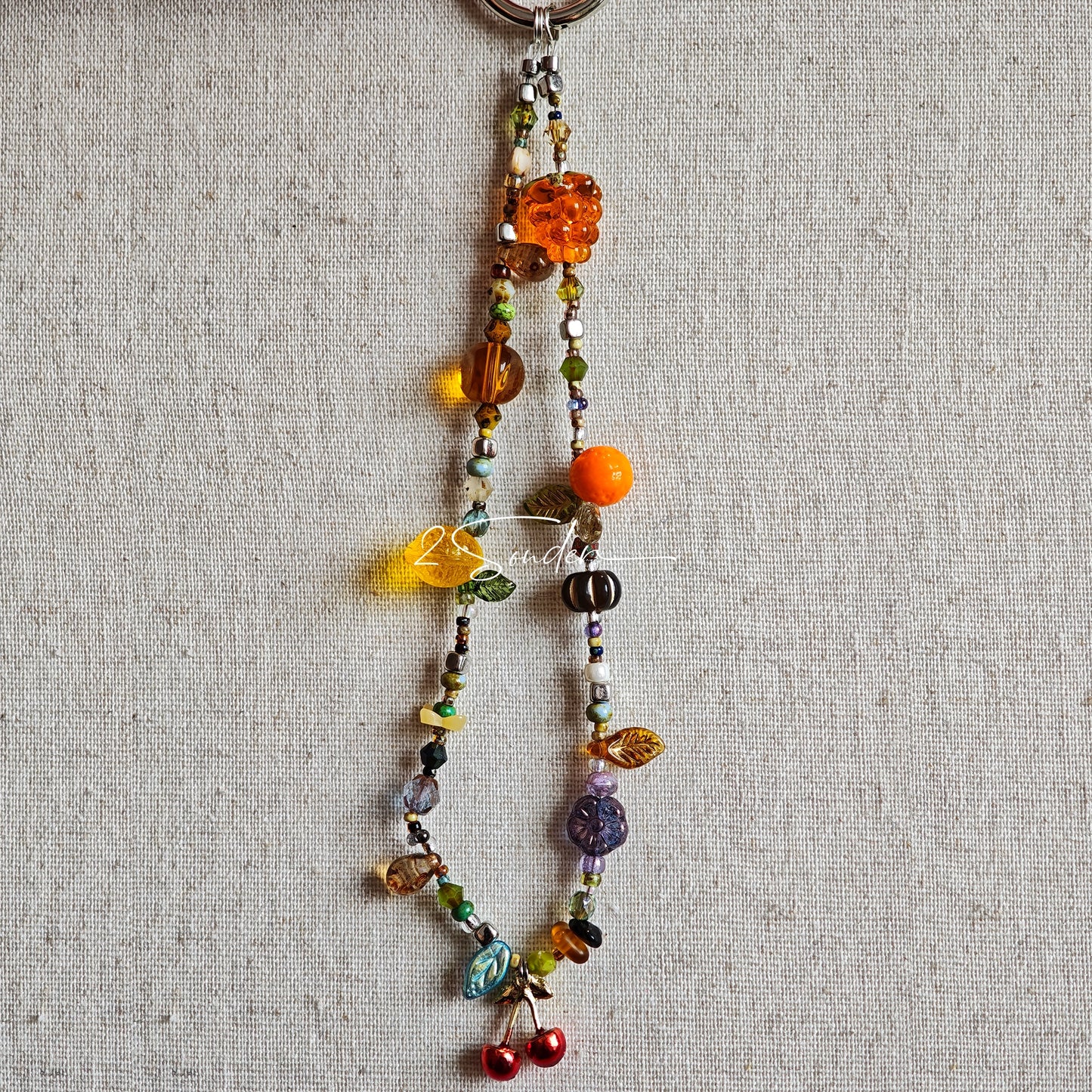 Handmade with vibrant Czech glass beads, this dazzling bag charm can be a phone strap, keychain accessory, or even a chic car decoration - perfect for adding a pop of joy to anything you own.