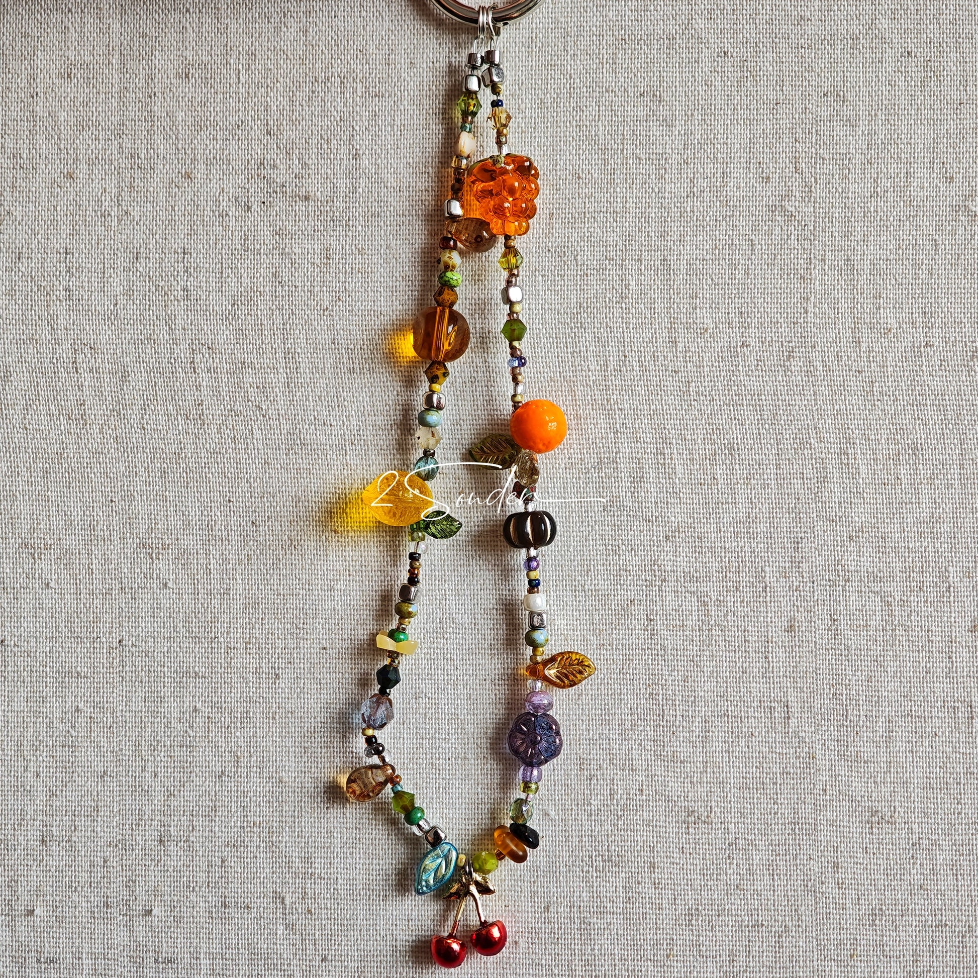Handmade with vibrant Czech glass beads, this dazzling bag charm can be a phone strap, keychain accessory, or even a chic car decoration - perfect for adding a pop of joy to anything you own.