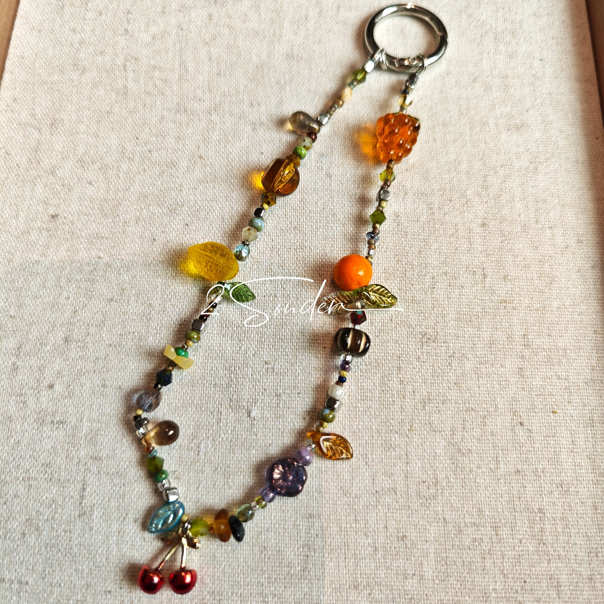 Handmade with vibrant Czech glass beads, this dazzling bag charm can be a phone strap, keychain accessory, or even a chic car decoration - perfect for adding a pop of joy to anything you own.