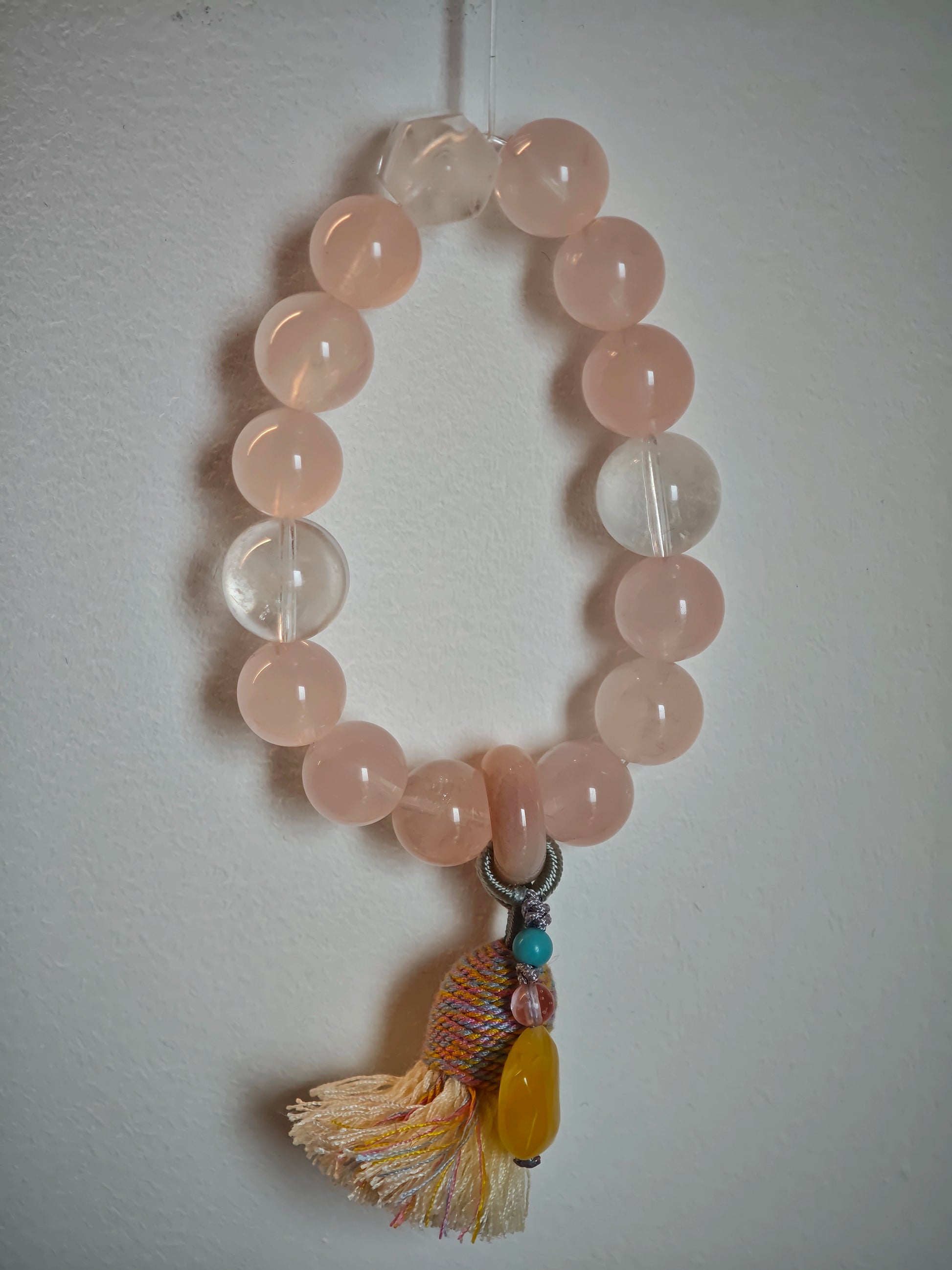 Blushing crystals flow into icy blue veins, topped with an amber star charm, sliding agate pearl, and graceful boho fringe.