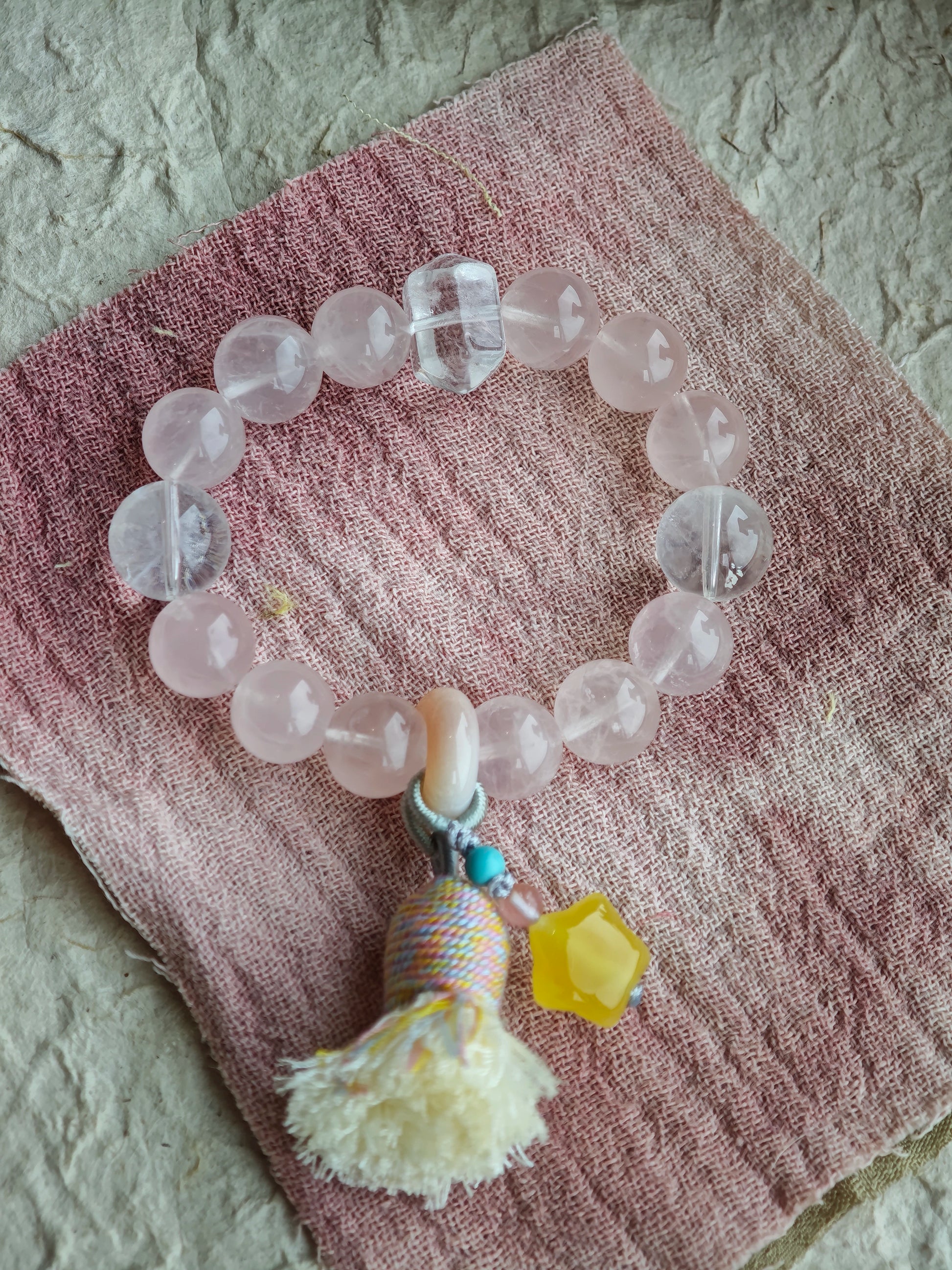 Soft romance meets mystic blue, finished by an amber star, agate traveler, and silky tassel for effortless gypsy chic.