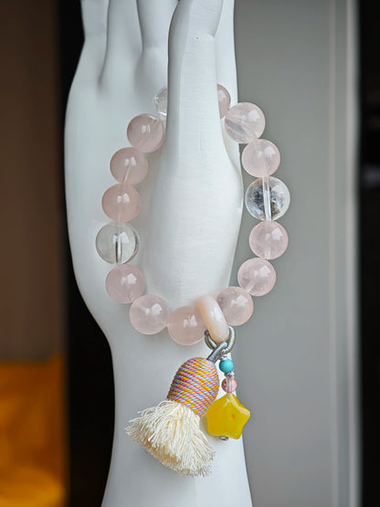 Gentle pink pulses beside celestial blue, and an amber star, agate bead, and airy tassel lend free-spirited sparkle.