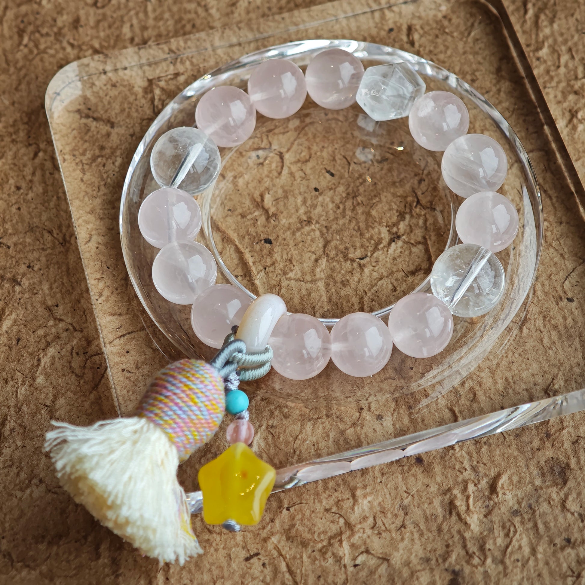 Blush-pink stones dance with icy blue needles, then amber starlight, a roaming agate bead, and a graceful fringe join the gypsy tale.