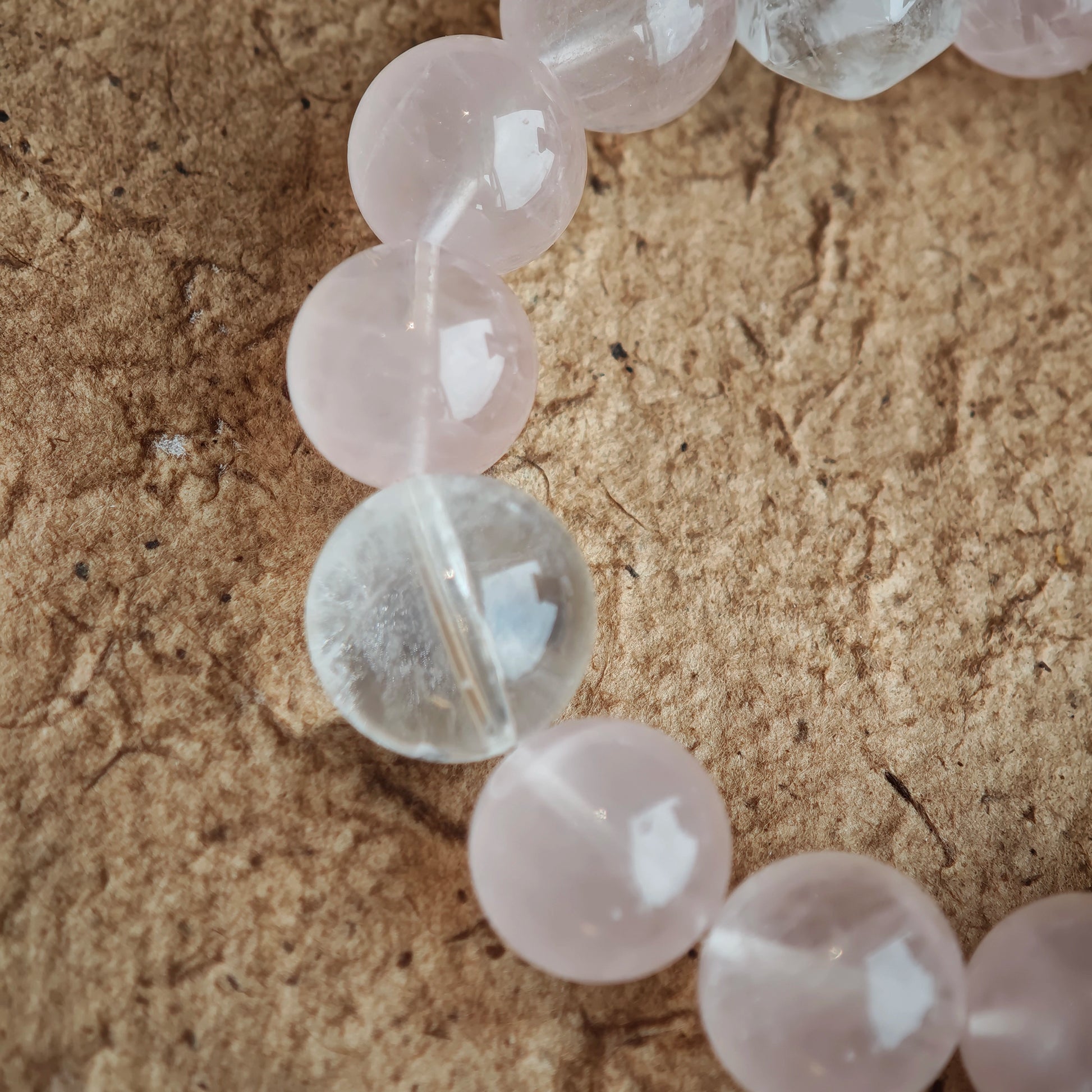 Gentle pink meets celestial blue, and playful charms—amber star, agate slider, airy tassel—elevate the free-spirit vibe.