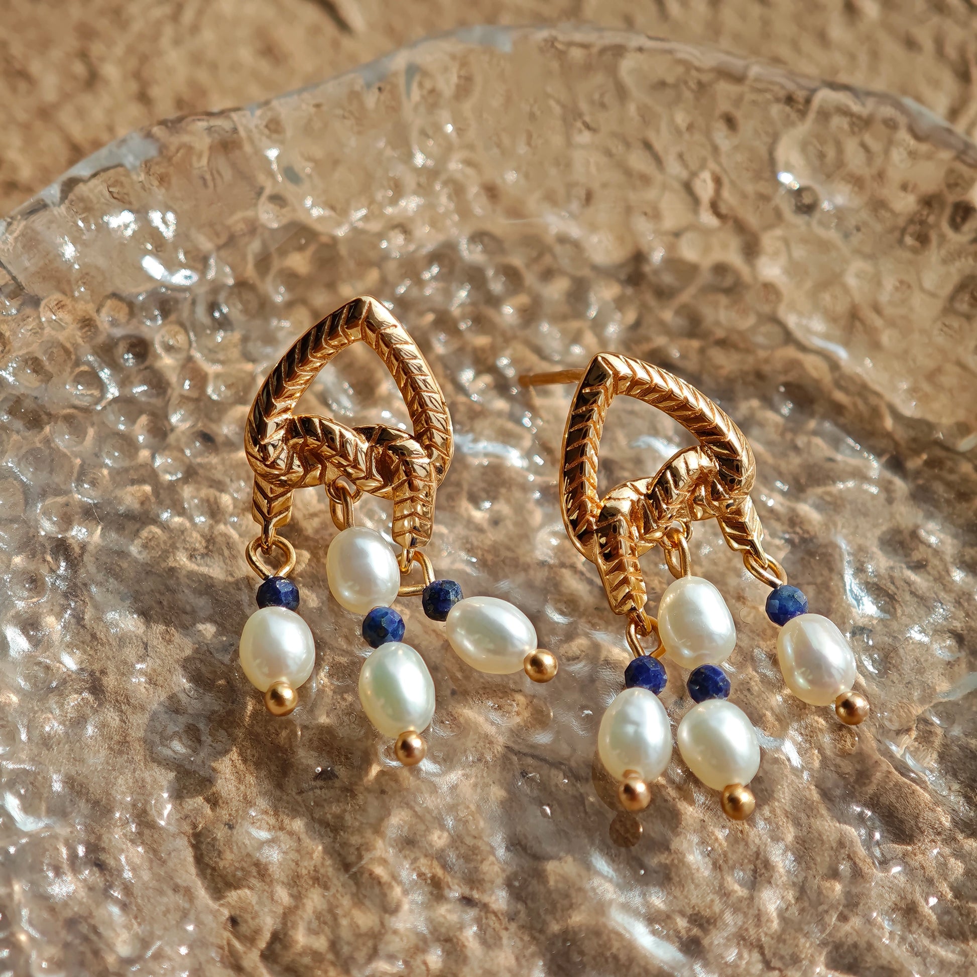 This is a pair of earrings that made of Lapis Lazuli, pearl and sterling silver. It's vintage and elegant.