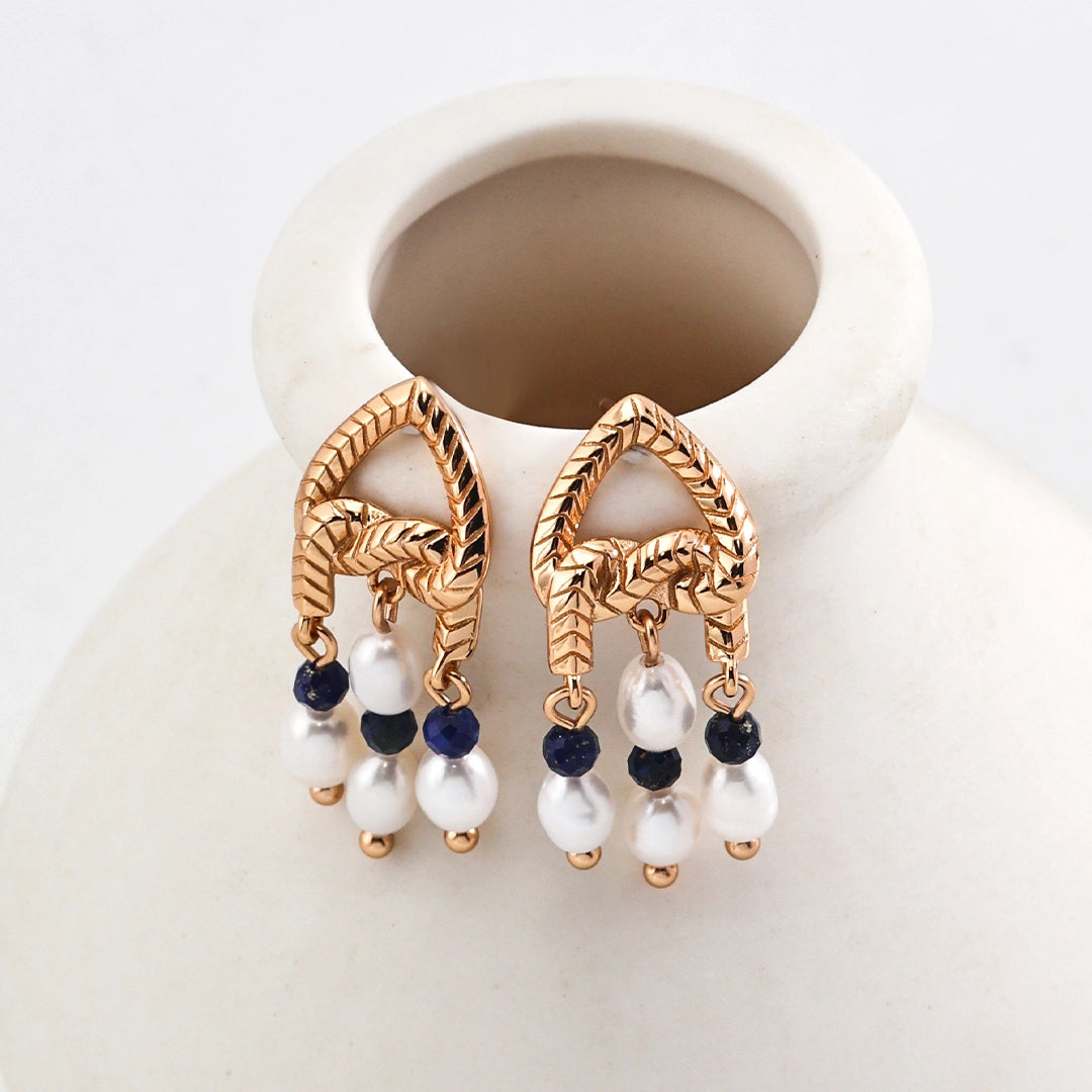 This is a pair of earrings that made of Lapis Lazuli, pearl and sterling silver. It's vintage and elegant.