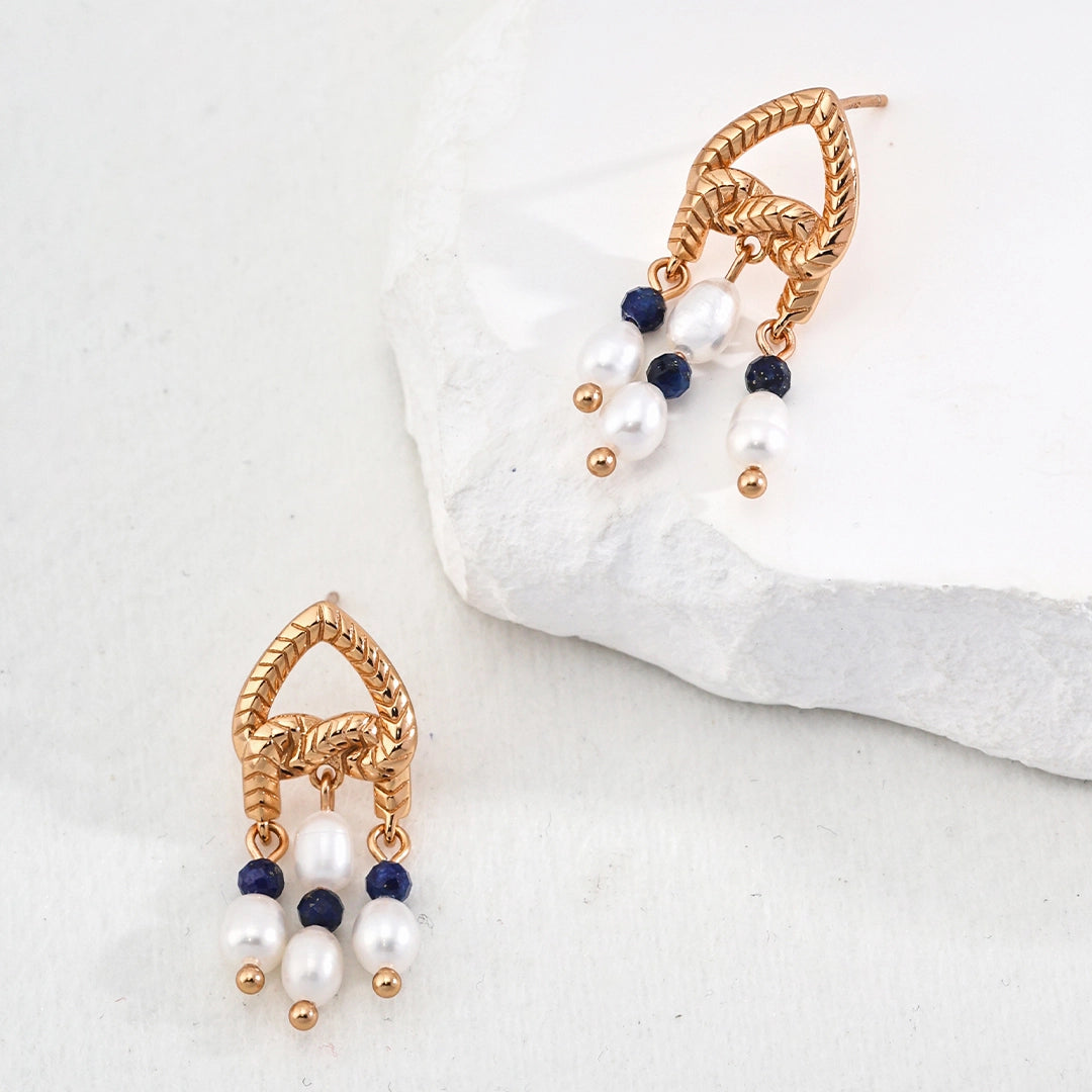 This is a pair of earrings that made of Lapis Lazuli, pearl and sterling silver. It's vintage and elegant.