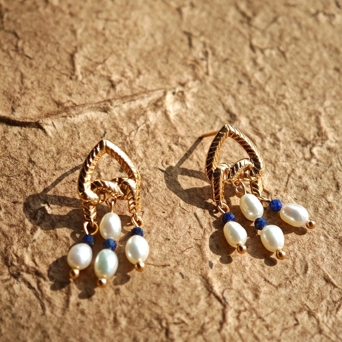 This is a pair of earrings that made of Lapis Lazuli, pearl and sterling silver. It's vintage and elegant.