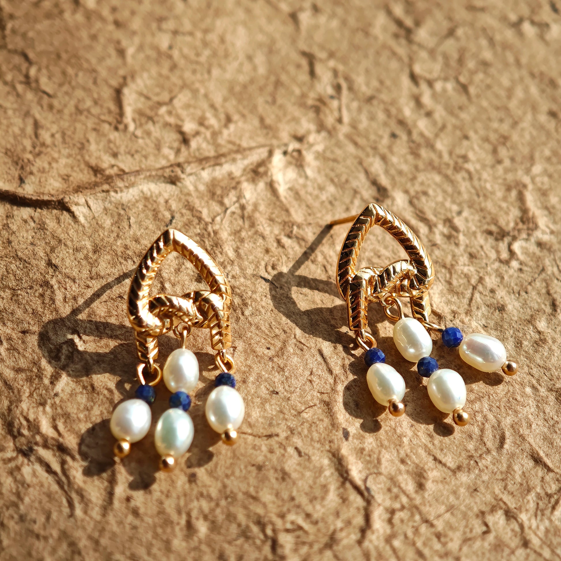This is a pair of earrings that made of Lapis Lazuli, pearl and sterling silver. It's vintage and elegant.