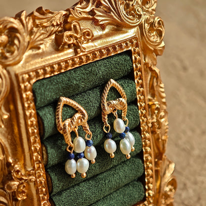This is a pair of earrings that made of Lapis Lazuli, pearl and sterling silver. It's vintage and elegant.