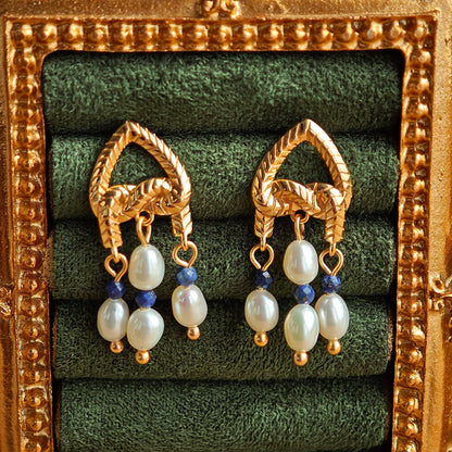 This is a pair of earrings that made of Lapis Lazuli, pearl and sterling silver. It's vintage and elegant.