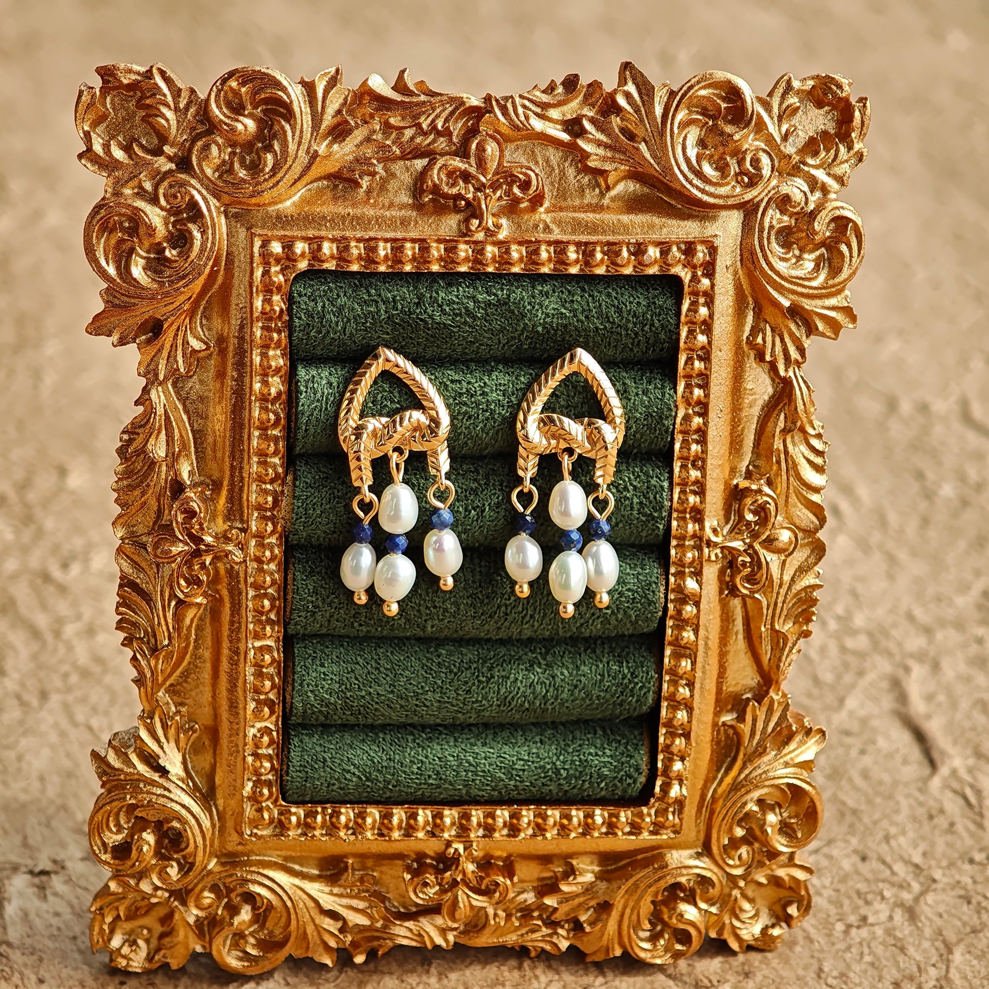This is a pair of earrings that made of Lapis Lazuli, pearl and sterling silver. It's vintage and elegant.