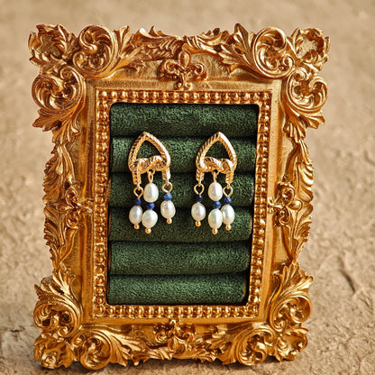 This is a pair of earrings that made of Lapis Lazuli, pearl and sterling silver. It's vintage and elegant.