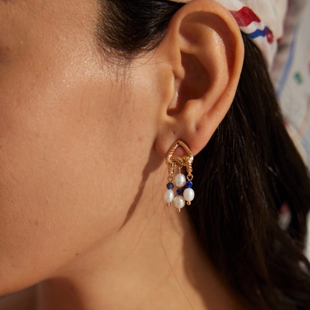 This is a pair of earrings that made of Lapis Lazuli, pearl and sterling silver. It's vintage and elegant.