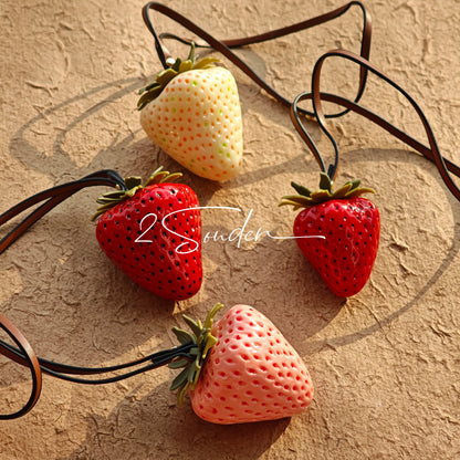 This is a simulated strawberry bag charm. The charm features a strawberry, the same size as a real strawberry, and is made of high-quality resin, giving it a very realistic appearance. It also has a leather cord attached, allowing it to be hung on bags, earphone cases, or used as a keychain. It's versatile and very cute.