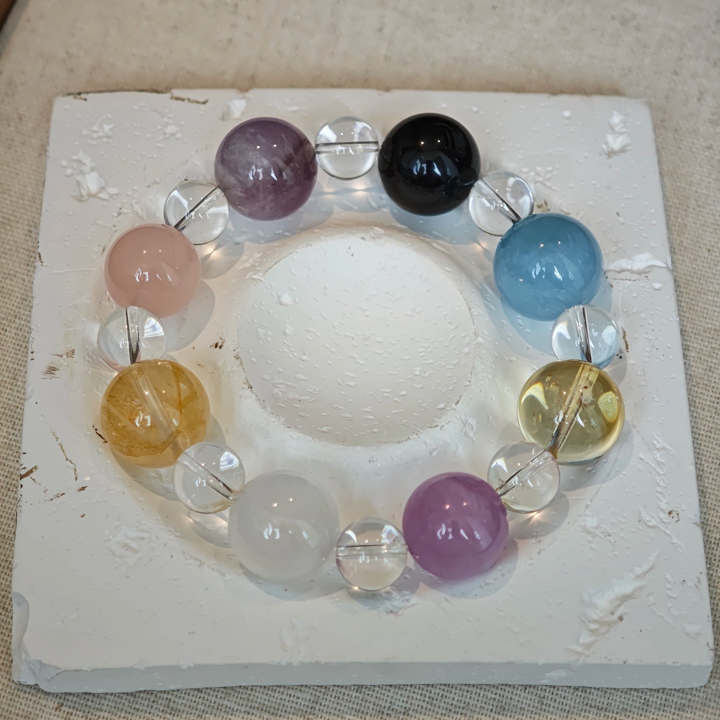 This is a multi-gemstone bracelets consists of Aquamarine, Amethyst, Citrine and White Phantom, etc.