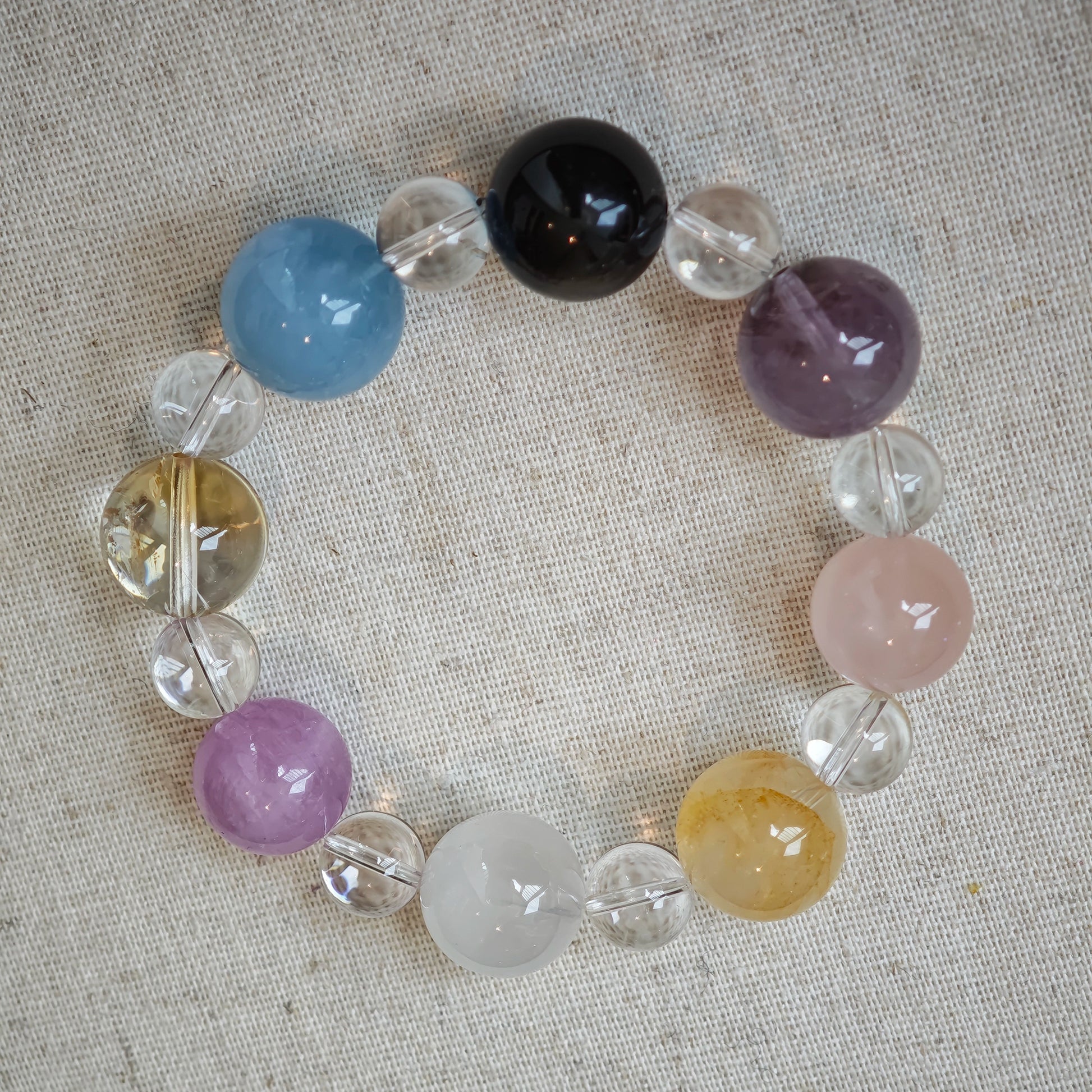 This is a multi-gemstone bracelets consists of Aquamarine, Amethyst, Citrine and White Phantom, etc.